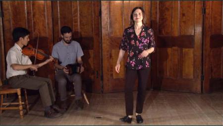 Kieran Jordan in a scene from her new instructional DVD, with musicians Armand Aromin (left) and Benedict Gagliardi.